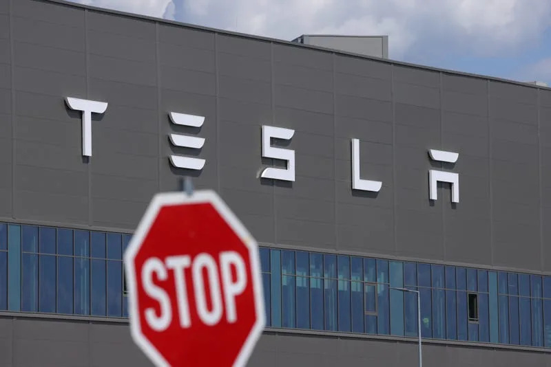 Tesla earnings show plunging revenue as Elon Musk's EV maker warns of hits from Trump's tariffs